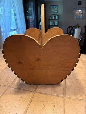 Very large wooden heart basket.see pictures and live. Handle looks crooked.